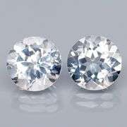 Superb 7.18ct high fire 9mm diamond white Topaz pair