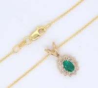 14kt Yellow gold oval Emerald and diamond halo pendant on chain necklace