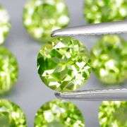 Dazzling 4.91ct untreated apple green Peridot set