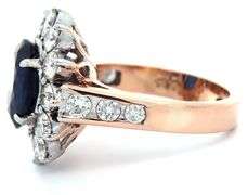 4.49ct Oval Sapphire and 1.50ctw Diamond Starburst Frame Ring in 18K