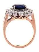 4.49ct Oval Sapphire and 1.50ctw Diamond Starburst Frame Ring in 18K