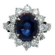 4.49ct Oval Sapphire and 1.50ctw Diamond Starburst Frame Ring in 18K