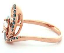 Na Hoku 0.70ctw White and Irradiated Blue Diamond with Mother of Pearl Wave Ring in 14K