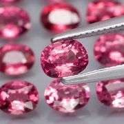 Remarkable 6.44ct reddish pink Rhodolite Garnet set