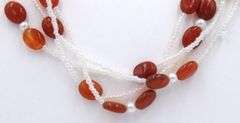 Set of multi row pearl and red agate necklace with matching bracelet and dangle earrings