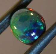 Exciting! 1.56ct floral fairy fire flashing Black Opal