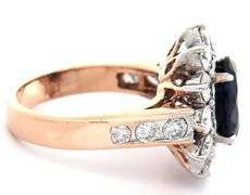 4.49ct Oval Sapphire and 1.50ctw Diamond Starburst Frame Ring in 18K