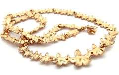 Polished Graduated Plumeria Station Necklace in 14K