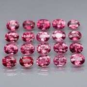 Remarkable 6.44ct reddish pink Rhodolite Garnet set