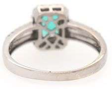 1.00ct Emerald and 0.50ct Diamond Halo Ring in 18K