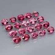 Remarkable 6.44ct reddish pink Rhodolite Garnet set