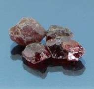 Enchanting 27.25ct untreated uncut Rhodolite Garnet set