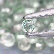 Fantastic 5.09ct diamond cut GREEN Sapphire set