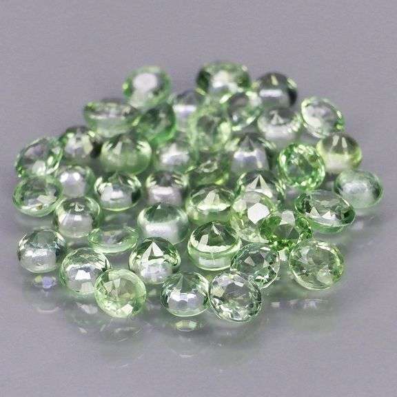 Awesome 5.54ct diamond cut green Sapphire set