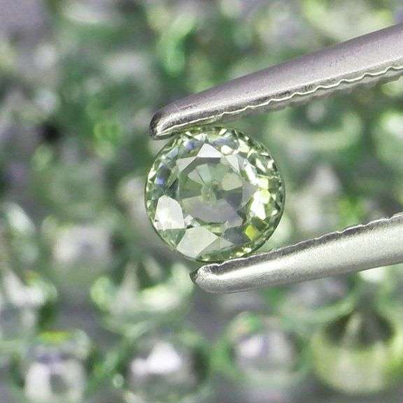 Awesome 5.54ct diamond cut green Sapphire set