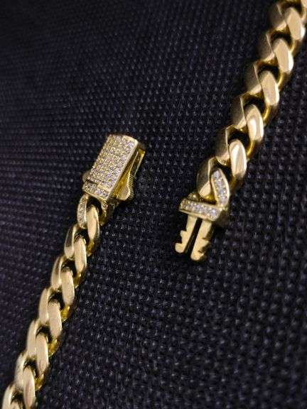 A CLASSIC 14K YELLOW-GOLD CUBAN-LINK CHAIN