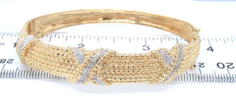 14kt Yellow gold approximate 0.15ctw diamond Triple X bangle bracelet