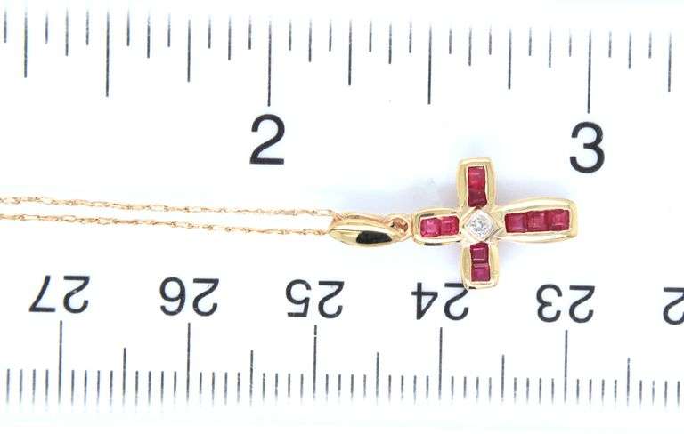 10kt Yellow gold Ruby and diamond accent cross pendant on chain necklace