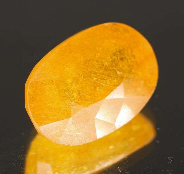 Vibrant 7.96ct golden orange Mozambique Sapphire