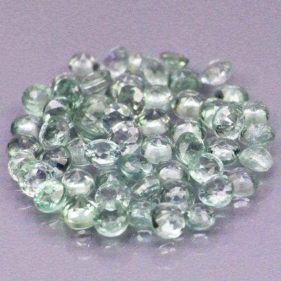 Fantastic 5.18ct diamond cut GREEN Sapphire set