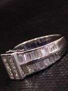 A MAGNIFICENT 14K WHITE GOLD RING WITH PRINCESS CUTS AND BAGUETTES