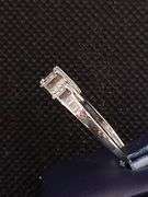 A GLEAMING 14K WHITE GOLD RING WITH PRINCESS CUT DIAMONDS