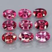 Remarkable 6.34ct violet pink Rhodolite Garnet set