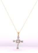 14kt Yellow gold baguette and round diamond cross pendant on chain
