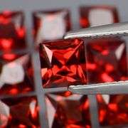 Tremendous 6.84ct princess cut cherry red Garnet set