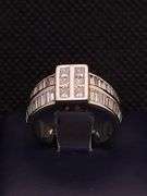 A MAGNIFICENT 14K WHITE GOLD RING WITH PRINCESS CUTS AND BAGUETTES
