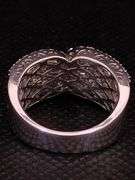 A GLEAMING 18K WHITE GOLD RING WITH BRILLIANT ROUND DIAMONDS AND BAGUETTES