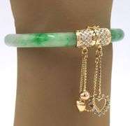 14kt Yellow gold Jade and diamond accent hinged bangle bracelet