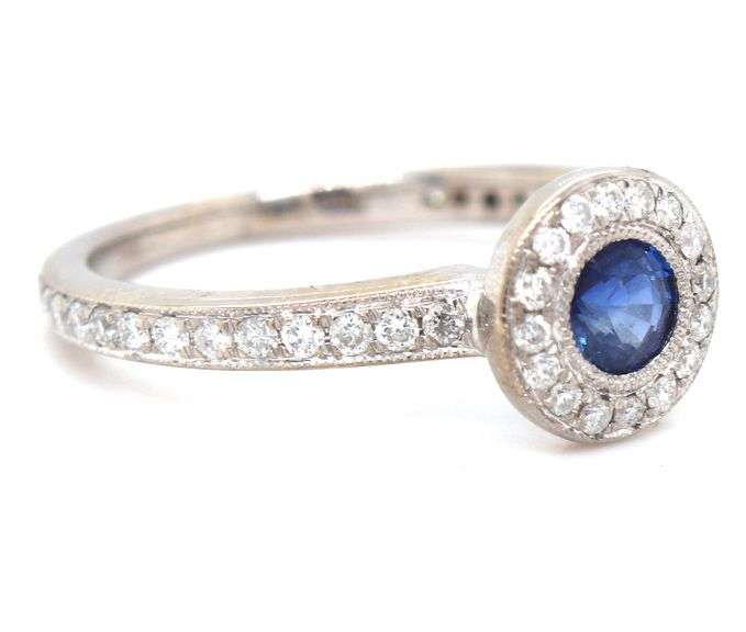14kt White gold blue sapphire and diamond halo ring