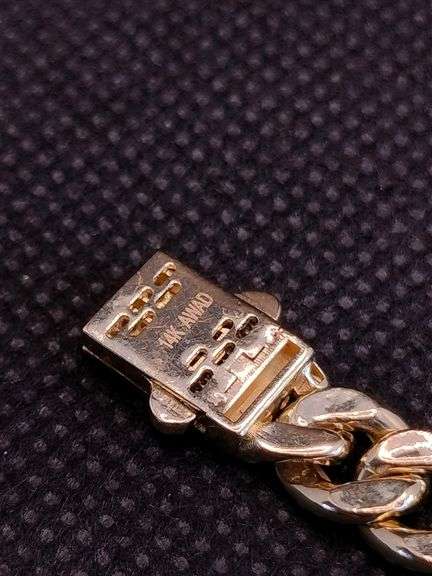 A STUNNING SEMI-SOLID 14K YELLOW GOLD CUBAN LINK BRACELET