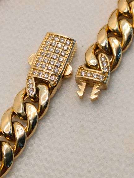 A STUNNING SEMI-SOLID 14K YELLOW GOLD CUBAN LINK BRACELET
