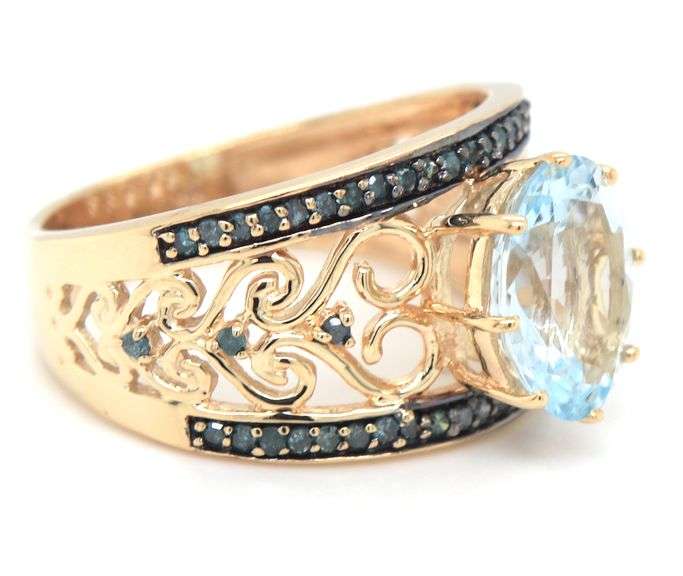 10kt Yellow gold oval Aquamarine and IR blue diamond ring