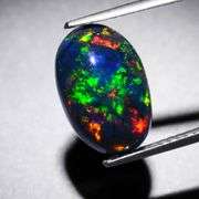 Magnificent 2.19ct full body flashing Black Opal