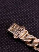 A STUNNING SEMI-SOLID 14K YELLOW GOLD CUBAN LINK BRACELET