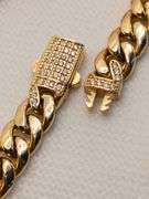 A STUNNING SEMI-SOLID 14K YELLOW GOLD CUBAN LINK BRACELET