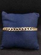 A SLEEK AND SOLID 14K YELLOW GOLD CUBAN LINK BRACELET