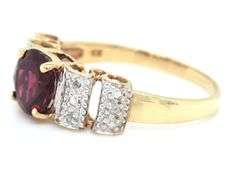 Garnet and diamond scalloped ring in yellow gold