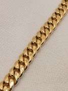 A STUNNING SEMI-SOLID 14K YELLOW GOLD CUBAN LINK BRACELET