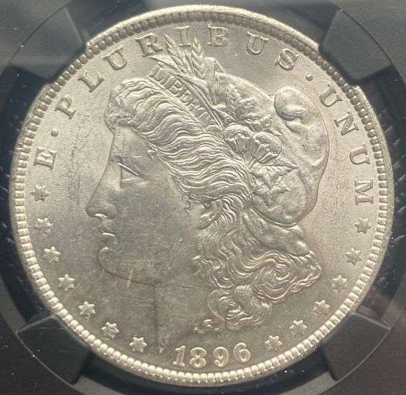 1896 NGC Brilliant Uncirculated Morgan $ With Original Bag Fragment.