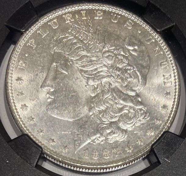 1887 NGC Brilliant Uncirculated Morgan $ With Original Bag Fragment.