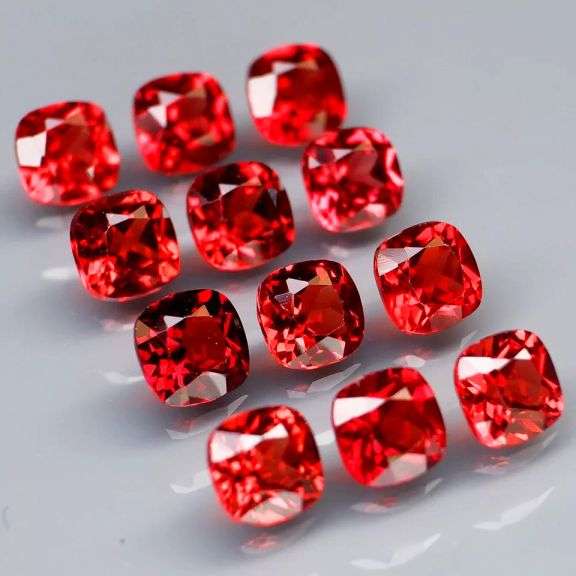 Nice 5.11ct cushion cut cherry red Garnet set