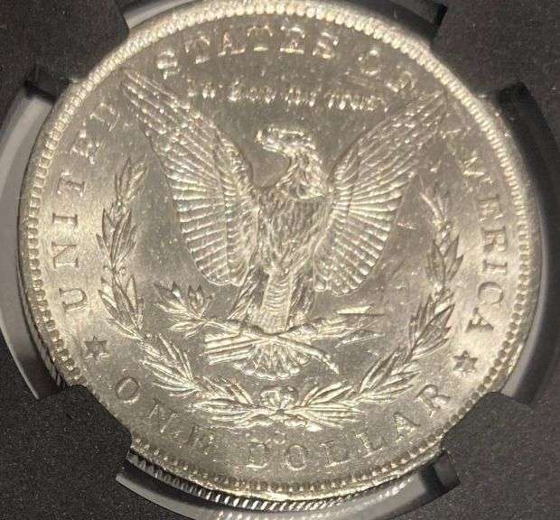 1884 O Brilliant Uncirculated Morgan $ NGC With Original Bag Fragment