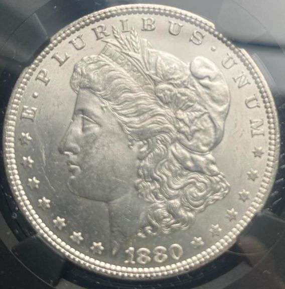 1880 Brilliant Uncirculated Morgan $ NGC With Original Bag Fragment