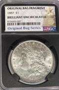 1887 NGC Brilliant Uncirculated Morgan $ With Original Bag Fragment