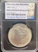 1883 O Brilliant Uncirculated  Morgan $ NGC With Original Bag Fragment