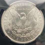 1896 NGC Brilliant Uncirculated Morgan $ With Original Bag Fragment.